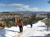 22-Mommy_and_Kenny_hiking_down_the_trail-packed_snow_with_no_ice,but_mud
