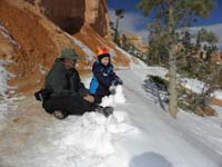 27-Daddy_and_Kenny_building_a_snowman_on_the_trail