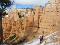 31-Mommy_and_Kenny_on_trail_heading_towards_a_doorway_in_the_rock