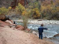 80-Kenny_throwing_rocks_in_the_river_while_Daddy_takes_photos