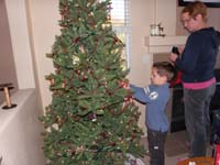 07-Kenny_helps_Baba_decorate_the_tree