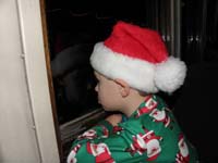 16-Kenny_watches_out_the_window_looking_for_the_North_Pole