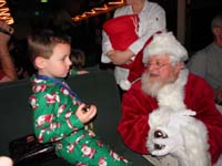 31-Kenny_meets_Santa_and_receives_a_bell_from_Santa's_sleigh-also_received_three_others