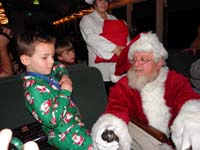 33-Kenny_meets_Santa_and_receives_a_bell_from_Santa's_sleigh