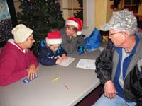 37-everyone_watching_as_Kenny_writes_a_letter_to_Santa