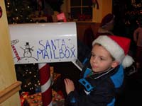 40-Kenny_placing_the_letter_in_Santa's_mailbox