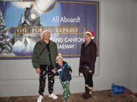 48-Daddy_Kenny_and_Mommy_with_Polar_Express_sign