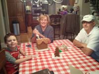 50-Kenny_Grammy_and_Grandpa_Duke_with_the_Gingerbread_House_they_built