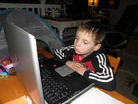 27-Kenny_is_very_tired_trying_to_relax_watching_a_video_on_his_computer