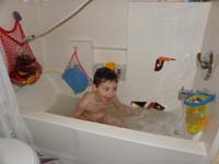 30-having_fun_taking_a_bath-he_figured_out_himself_to_put_showerhead_in_that_position