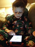 31-reading_a_story_on_Mommy's_Kindle_Fire