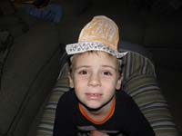 33-Kenny_wearing_a_sombrero_he_made_during_art_class_at_school