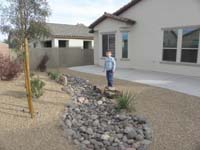 40-Kenny_likes_all_the_rocks_in_Baba_and_Poppy's_backyard