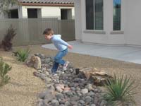 41-Kenny_jumping_over_the_rocks