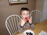 49-Kenny_likes_to_fool_around_by_putting_raspberries_on_his_fingers