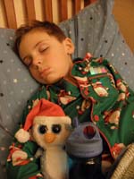 51-Kenny_sleeping_with_glow_sticks_in_shirt_pocket,Fairbanks,and_water_bottle_for_cough