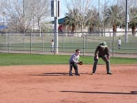 07-Daddy_becomes_an_assistant_coach-Daddy_shows_Kenny_how_to_be_ready_to_catch_a_ball_hit_to_him