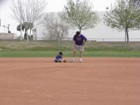 37-Kenny_getting_a_feel_for_the_field-Daddy_tells_him_to_get_up