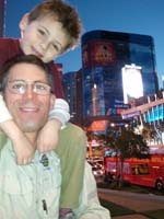 35-Kenny_on_Daddy's_shoulders_with_Harmon_Tower_in_background