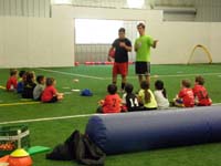 54-all_the_kids_getting_instructions_from_the_coaches