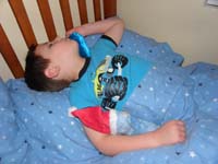 58-Kenny_sleeping_with_ice_pack_and_Fairbanks-he_hurt_himself_on_cheek