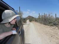 032-Kenny_trying_to_look_for_the_snake,but_it's_deep_in_the_bushes