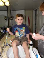 066-Kenny_fells_down_many_times_on_sidewalk-Mommy_tending_to_wounds