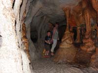 076-Kenny_and_Mommy_walking_through_an_artificial_cave_display-very_authentic