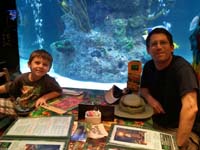 25-Kenny_and_Daddy_in_front_of_fish_tank_at_Rainforest_Cafe