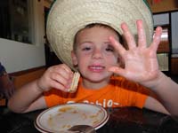 16-messy_sticky_cinnamin_honey_covered_hands-he_struggled_to_eat_churros-didn't_want_Daddy_to_take_them