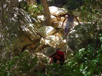 16-Leyna_and_Kenny_climbing_rocks_at_Lost_Creek_Fall