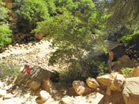 19-Leyna_and_Kenny_climbing_rocks_at_Lost_Creek_Fall