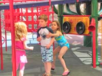 67-Leyna_pulls_Kenny_away_from_the_Daddy_paparazzi-pretending_she_didn't_want_me_to_take_more_pictures