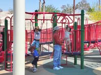 70-Poppy_helping_Brooke_climb_the_bars_while_Kenny_tries_himself_but_falls_each_time