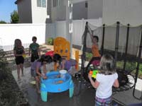 74-time_to_play_with_the_neighborhood_girls_in_our_backyard