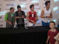 33-he_gets_his_drum_sticks_signed_by_the_group