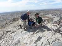 13-three_generations_on_Lone_Mountain-dusty_day_from_winds-Las_Vegas_Strip_in_background