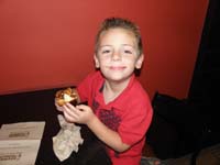 02-Kenny_gets_a_chocolate_sprinkled_covered_donut_from_Dunkin'_Donuts