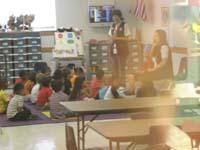 03-Kenny_in_his_class-blurry_because_through_tinted_glass_zoomed_and_no_flash