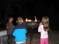 05-Alex_Kenny_Sierra_roasting_small_marshmallows_on_grill-no_fire_ring_for_our_site_so_no_real_fire