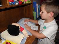 16-Kenny_likes_to_tuck_Danny_(formally_Damian)_in_his_bed_then_reads_a_bedtime_story