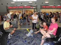 39-Poppy_Baba_Kenny_and_Mommy_relaxing_eating_snacks_at_a_gate