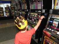 41-he's_trying_to_pull_the_handle_for_the_one_armed_bandit