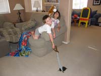 50-Kenny_and_Sarena_playing_with_Rocky_on_the_floor