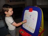 58-Kenny_shows_Mommy_what_he_made_for_her