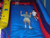 27-Daddy_and_Kenny_go_down_a_slide
