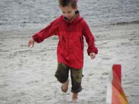21-Kenny_is_having_lots_of_fun_running_on_the_sand