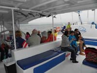 28-all_the_tourists-later_lots_from_Middle_Eastern_family_fed_the_fish_on_the_back_row