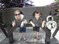 52-Mommy_and_Kenny_in_a_stockade-Kenny_looks_thrilled
