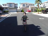 09-Kenny's_happy_riding_a_bike_without_training_wheels